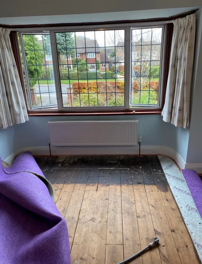 Floorboards lifted to reroute radiator pipework in Princes Risborough